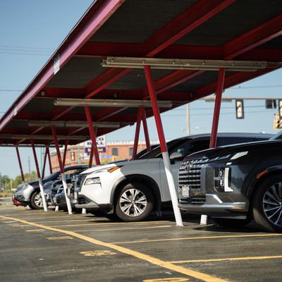 exterior, front curb area, cars waiting for service.