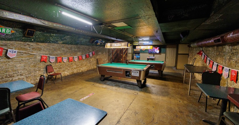 Interior, pool tables waiting for the guests