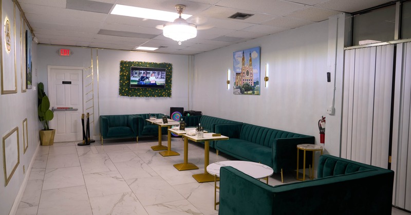 Green tufted velvet sofas and tables
