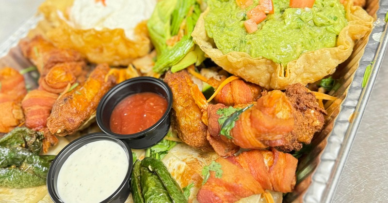 Assorted Mexican appetizers with dips
