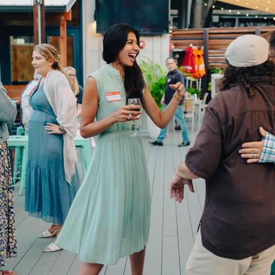 Patrons socializing at an outdoor event.