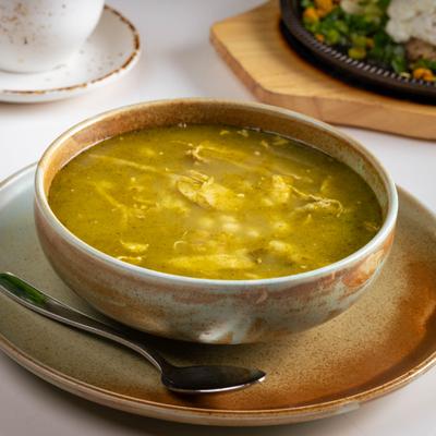 Bowl of Pozole Verde served on the table.