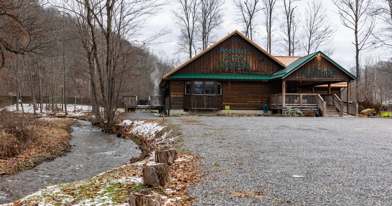 Exterior, front view to restaurant and river, parkin lot
