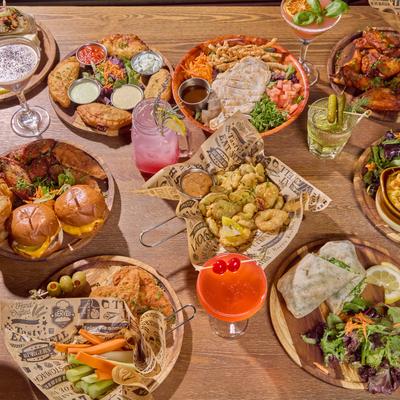 Assorted dishes and cocktails on a table.
