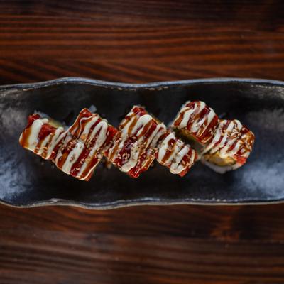 Sushi rolls topped with spicy tuna, roasted garlic, Hawaiian BBQ and wasabi sauces.