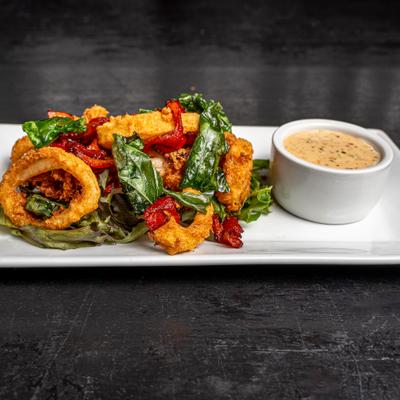 Crispy Calamari tossed with peppers and basil, served with spicy tomato aioli.