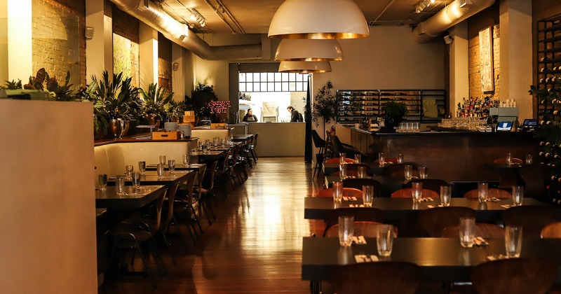 Interior, dining area with tables set for guests