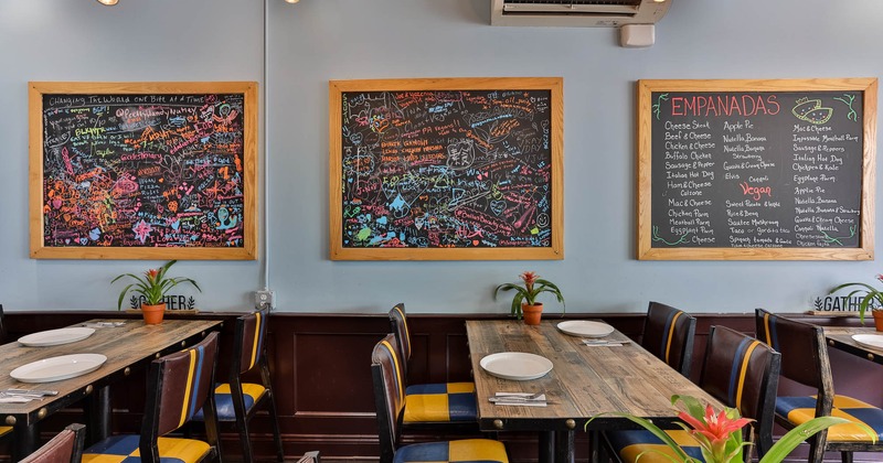 Dining area, chalkboard menu and art