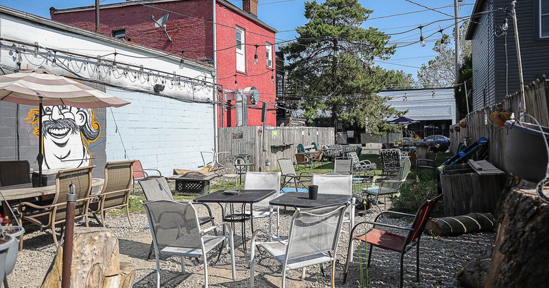 Outside, seating area with tables and chairs