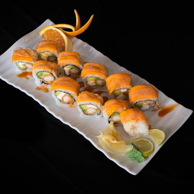 Sushi rolls with shrimp tempura, avocado, cream cheese, and fresh mango.