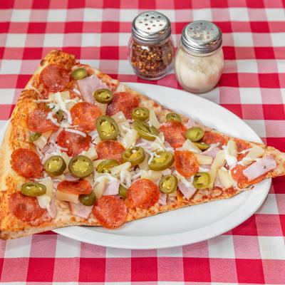 Pizza with ham, pineapple, pepperoni, and jalapenos.