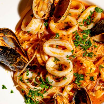 Angel hair pasta with mixed seafood and tomato sauce.
