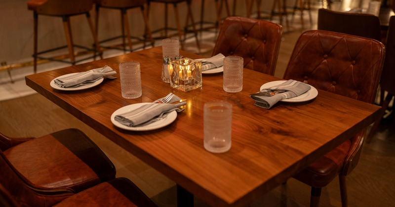 Interior, table fully set for guests