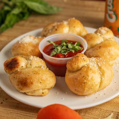Garlic knots served with marinara.