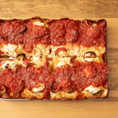 Square pepperoni pizza with hearty tomato sauce.