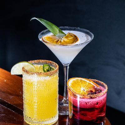 Three different cocktails served on a table.