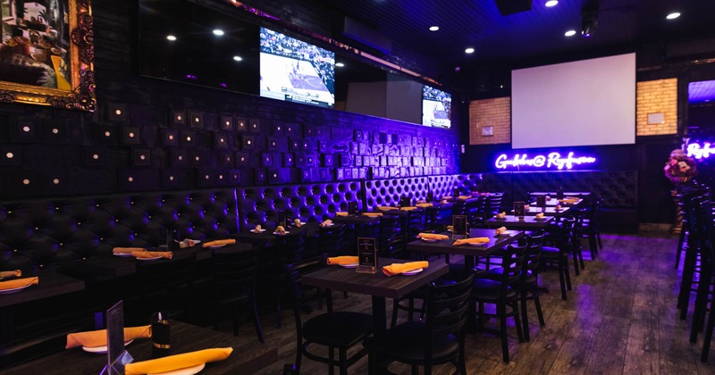 Interior, dining area, banquette seating, purple neon lighting