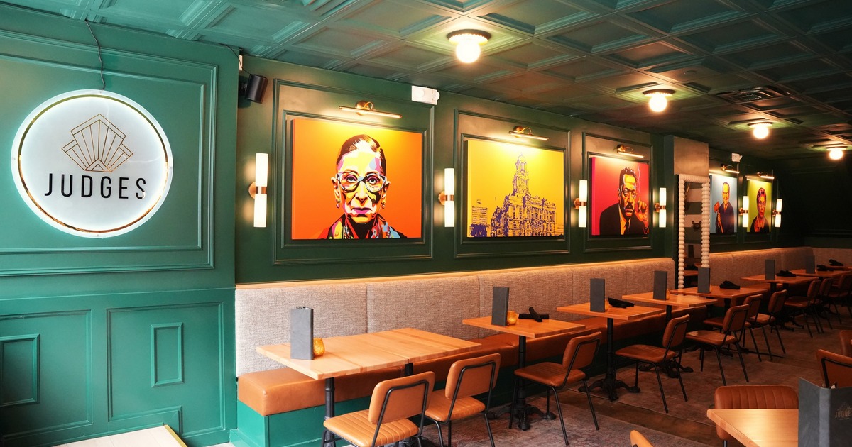 Interior, seating space, green walls with pop art paintings