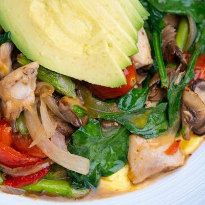 Open faced chicken omelette, close up.