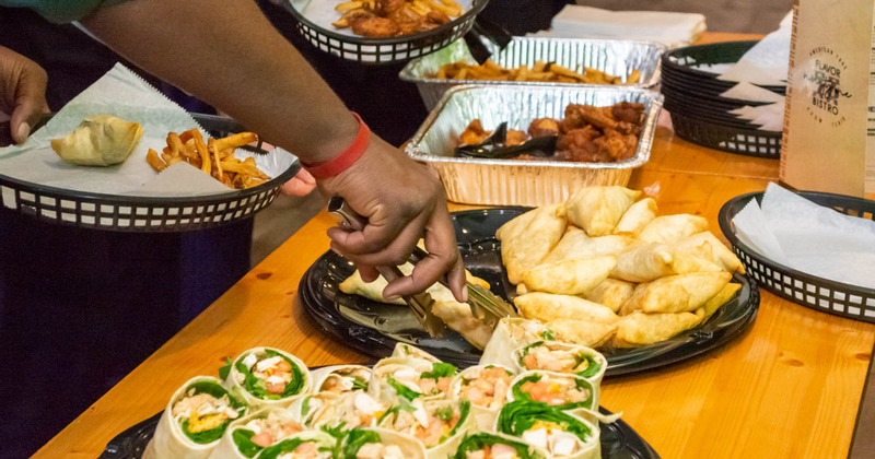Guests helping themselves to food on catering table
