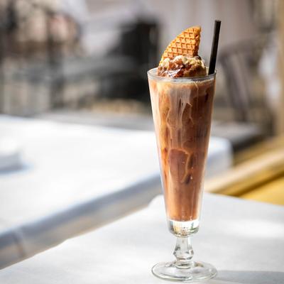 Chocolate cocktail, with whipped cream and a waffle on top