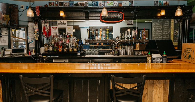 Interior, bar, chairs, drink rack behind