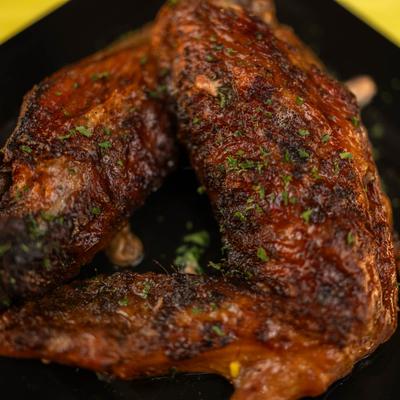 Seasoned and roasted turkey wings, close-up.
