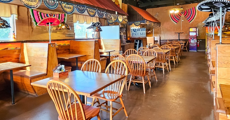 Dining area, boots, tables, chairs, Sombreros as decorations