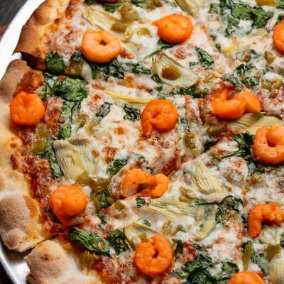 Cozumel Pizza - shrimp, spinach, artichoke, and green chilis.