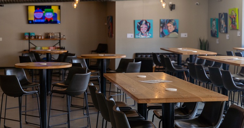 Interior space, seating area with guest's tables and chairs