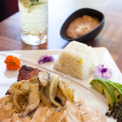 Grilled chicken with sides and a drink.