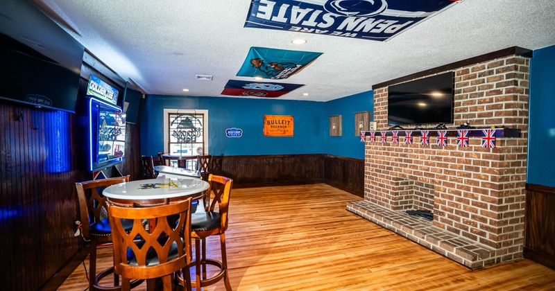 Interior featuring fireplace with a brick surround and a television mounted above it