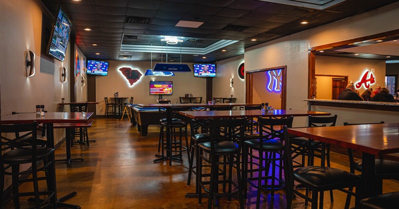 Interior,  tables and seats, pool table, TVs on walls