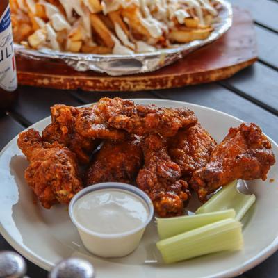 Chicken Wings  served with celery sticks and bleu cheese dressing.
