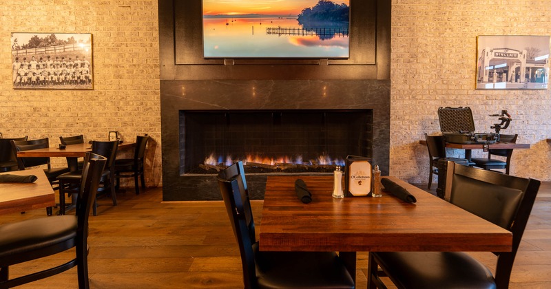 Interior, table and chair with fire place behind