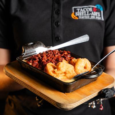 Queso dip with chorizo and fried shrimp.