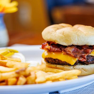 Bacon cheeseburger with fries.