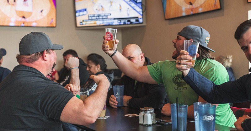 Customers watching a game