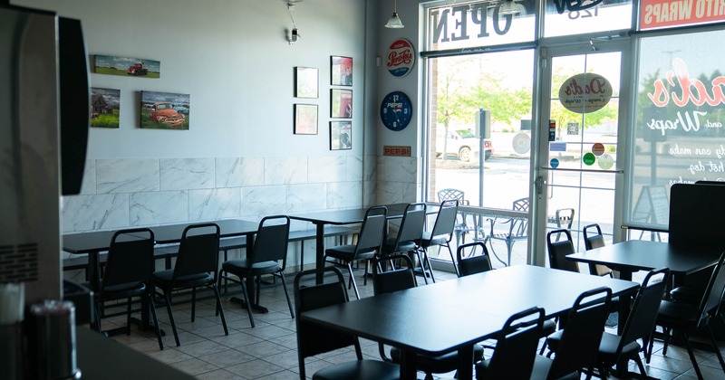 Interior, dining area, tables with benches and chairs, restaurant entrance, shop window