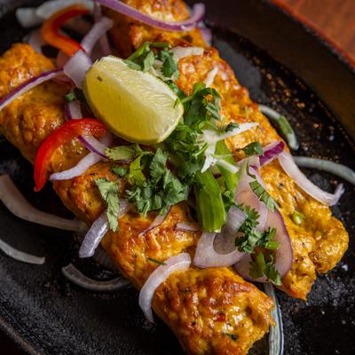 Chicken Seekh Kebab, with onions, herbs, and spices.