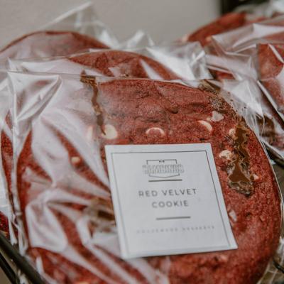 Red velvet cookie in clear packaging.