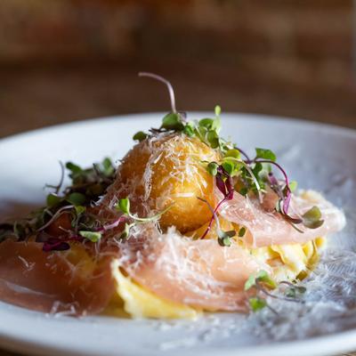 Pasta Carbonara with panko crusted egg and prosciutto.