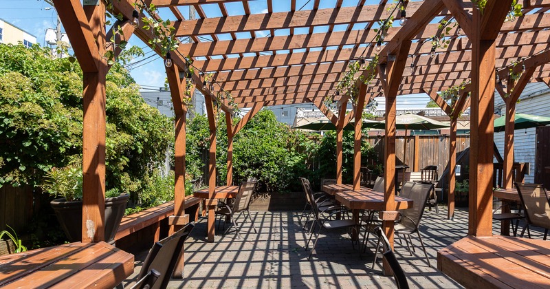Exterior, patio with tables, chairs and a lot of plants