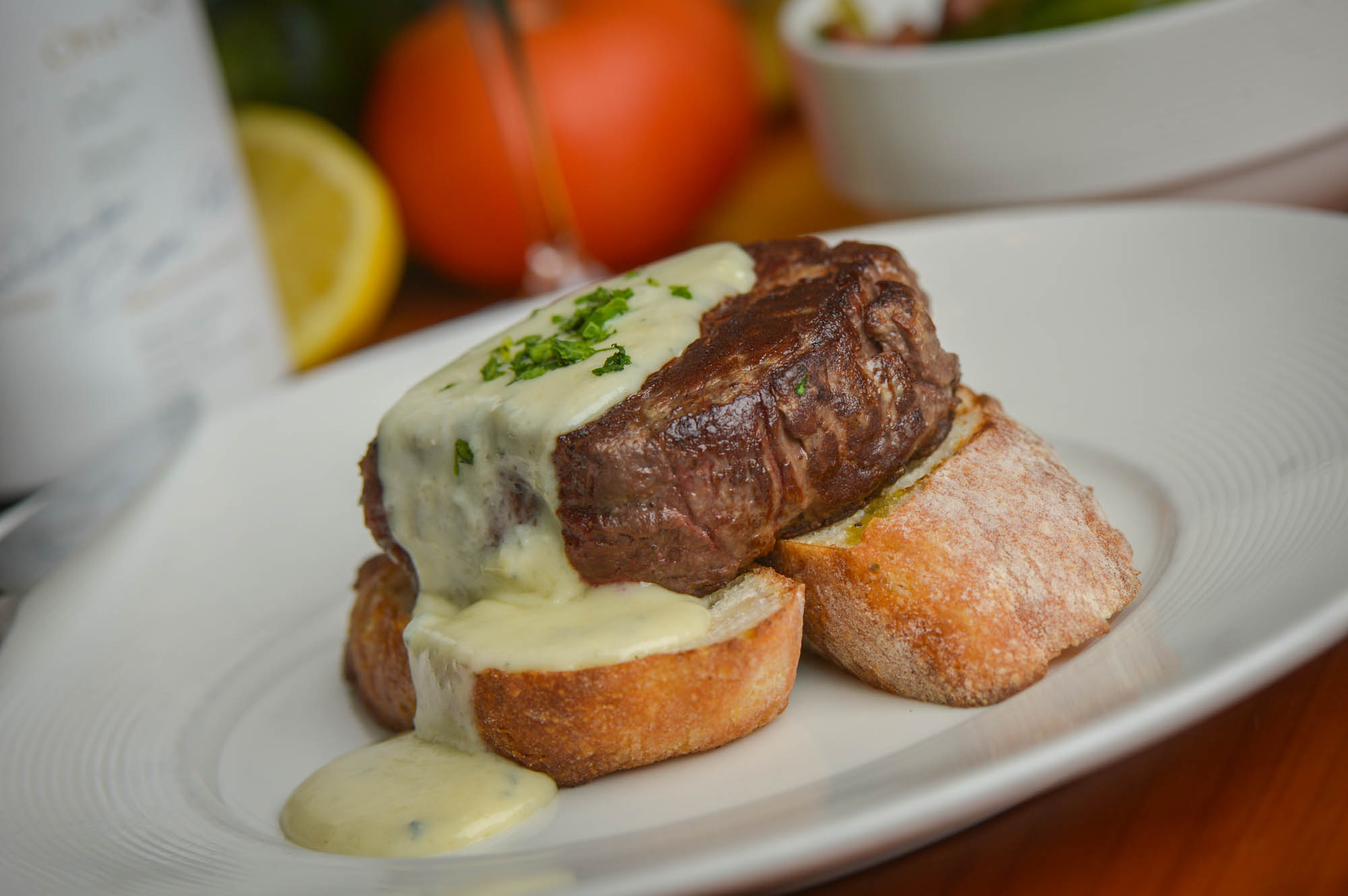 Filet mignon in a brandy and green peppercorn sauce served on toasted bread