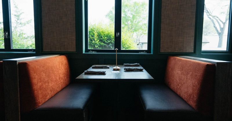 Interior, dining booth with a set table