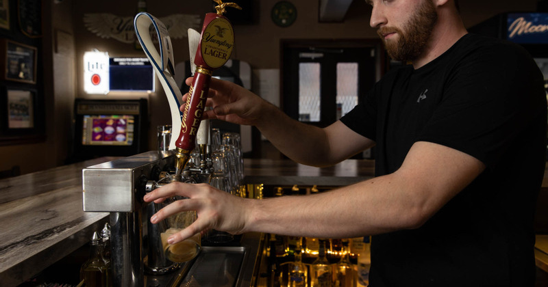 Interior, employee working at the bar