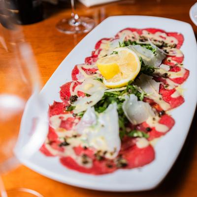 Beef carpaccio with cheese.