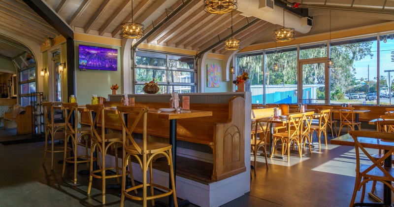 Interior, high tables and chairs in dining area