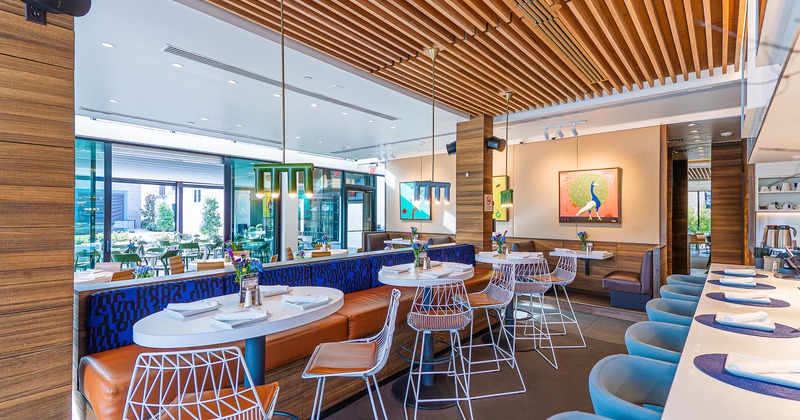 Modern and cozy interior dining area with set tables ready for guests