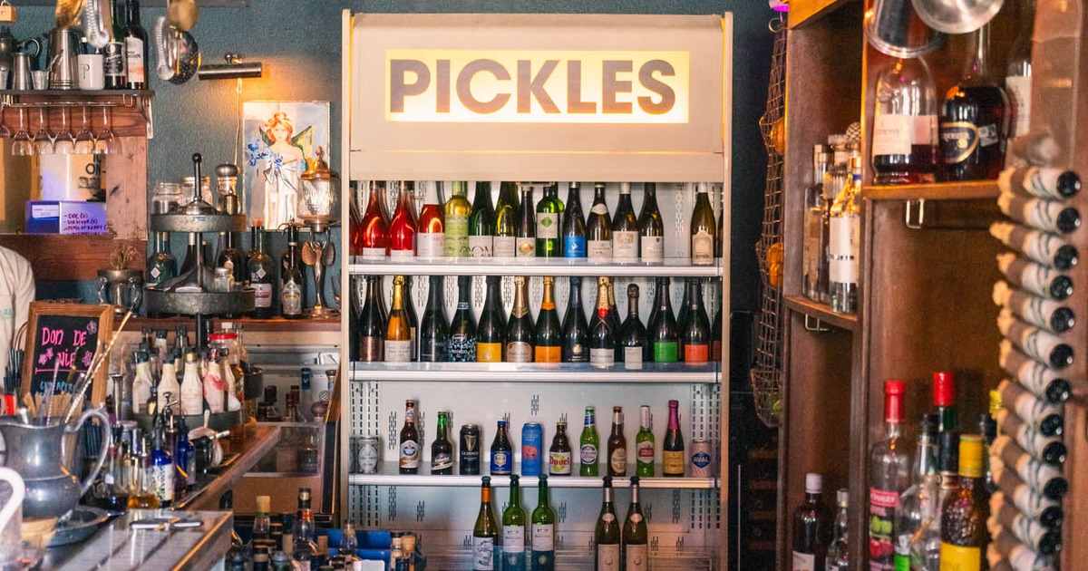 Bar interior with assorted drink bottles displayed on shelves